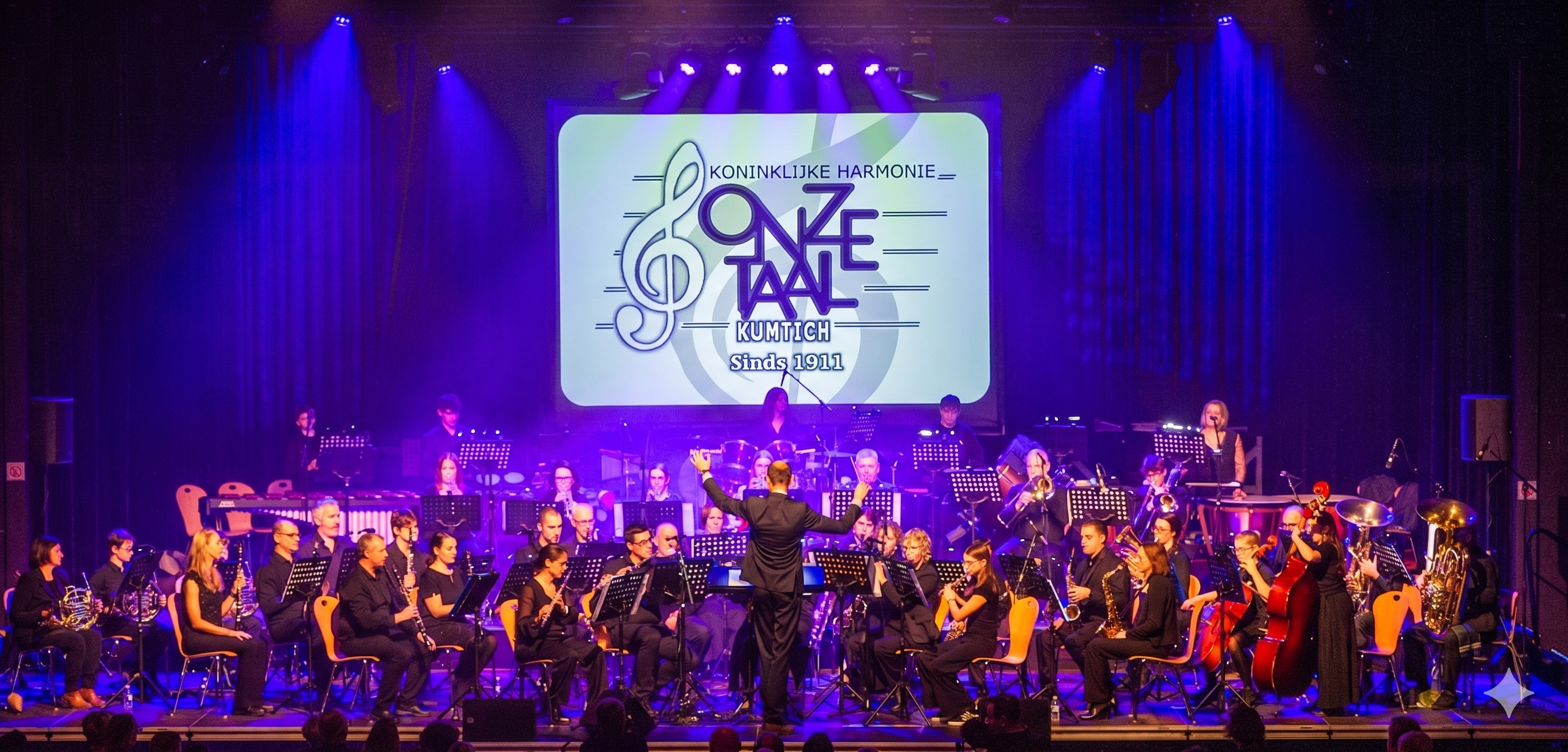 De Koninklijke Harmonie </br><span class=uk-text-primary> Onze Taal </span>uit Kumtich.